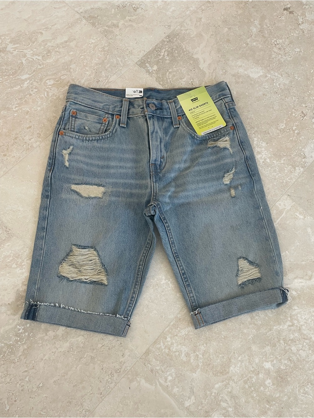 NWT Levi’s Performance 412 Slim Blue Distressed Denim Shorts